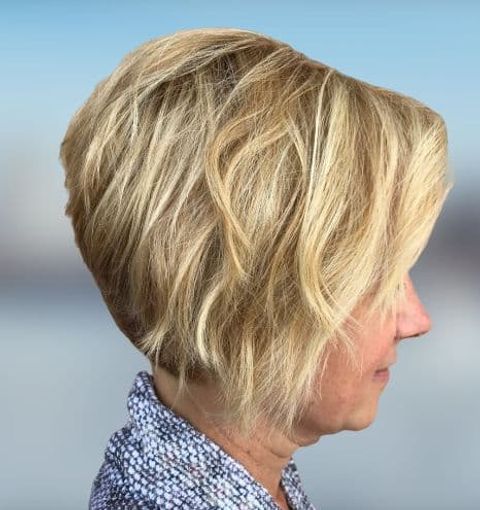 Layered asymmetrical short bob haircut for women over 60