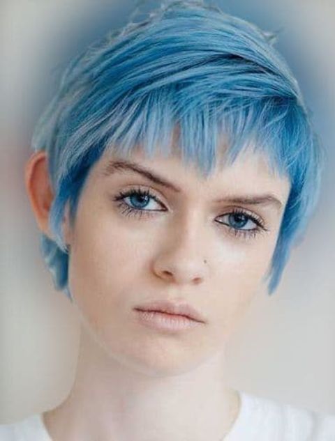 Side swept long pixie with blue hair color