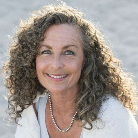Side swept curly hair for women over 60 in 2021-2022