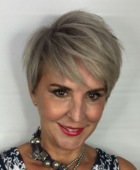Layered blonde short haircut over 50
