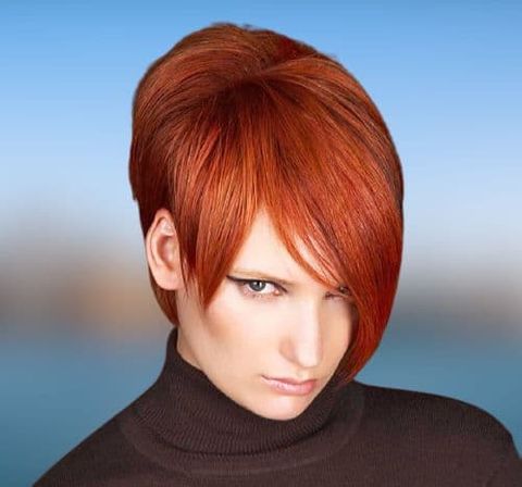 Red hair color short haircut with long hangs