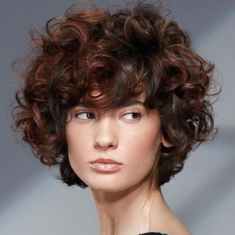 Messy curly haircut for oval face 2021-2022
