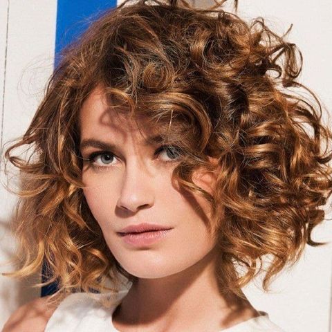 Side swept curl bob haircut for oval face 2021-2022