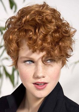 Brown hair color short curly haircut for woman with long face